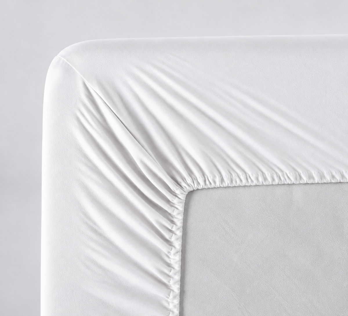 Plumelle Earth Fitted Sheet in Chalk, elastic all the way around for a neat fit