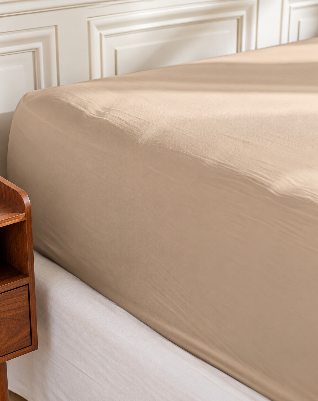 Plumelle Earth Fitted Sheet in Sand on a made bed